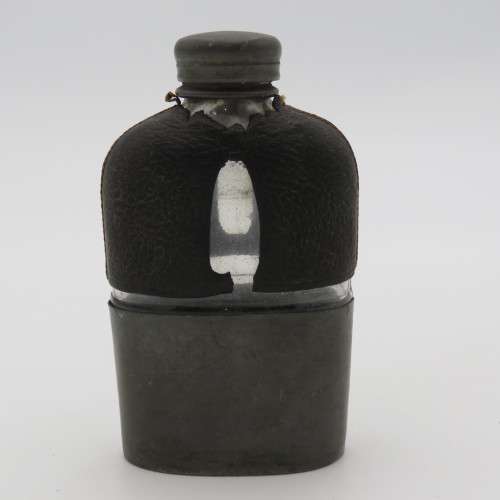 Antique leather clad glass hip flask with pewter lid and cup