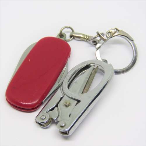 Vintage pocket knife and opener with pocket scissors