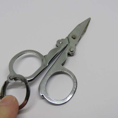 Vintage pocket knife and opener with pocket scissors