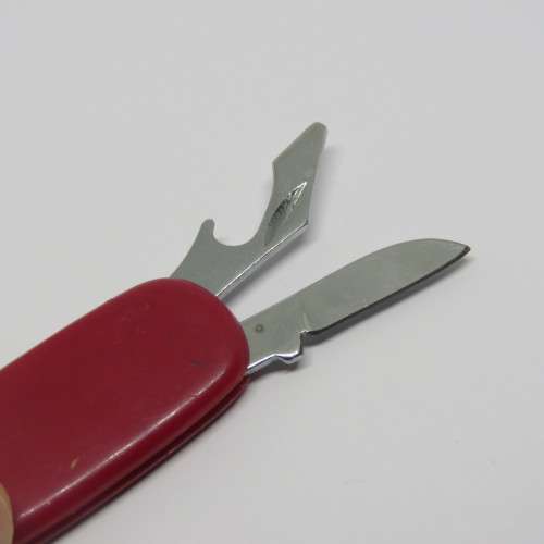 Vintage pocket knife and opener with pocket scissors