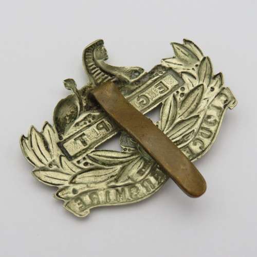 The Gloucestershire regiment cap badge with slide