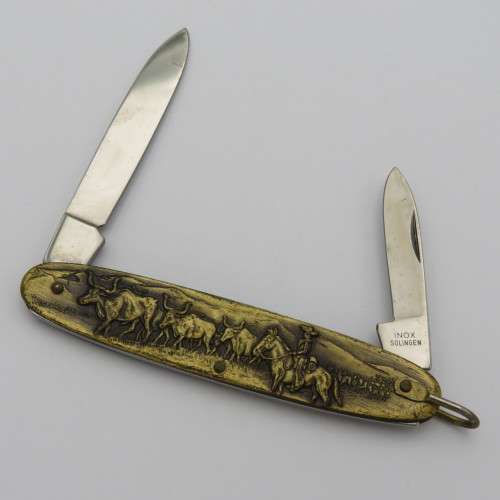 Vintage Inox pocket knife with brass cowboy motif