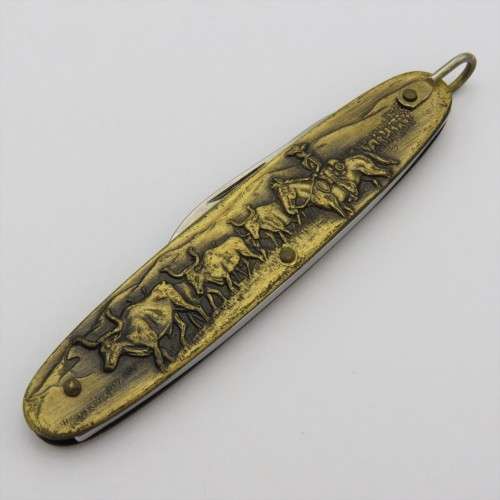 Vintage Inox pocket knife with brass cowboy motif
