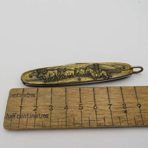 Vintage Inox pocket knife with brass cowboy motif