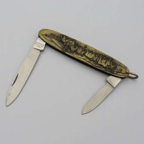 Vintage Inox pocket knife with brass cowboy motif