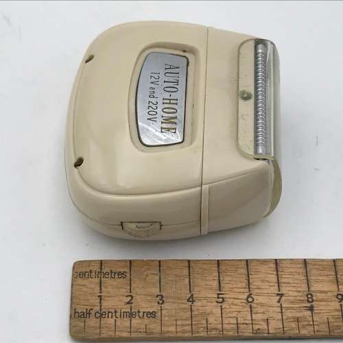 Vintage Remington Rollectric auto-home electric shaver