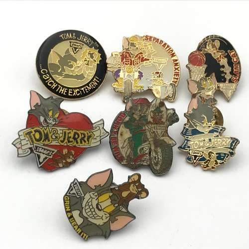 Lot of 7 Tom and Jerry pin badges issued by Steers