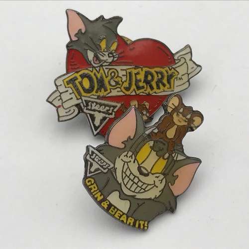 Lot of 7 Tom and Jerry pin badges issued by Steers
