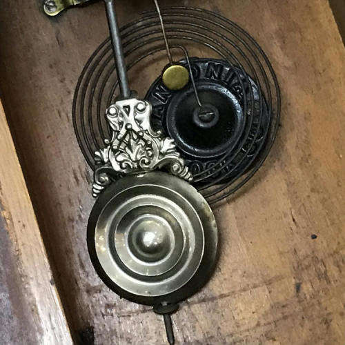 Antique Ansonia wall clock with beautifully decorated door