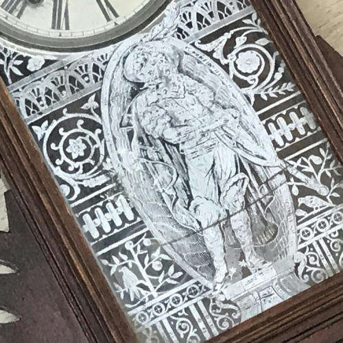 Antique Ansonia wall clock with beautifully decorated door