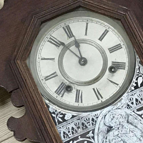 Antique Ansonia wall clock with beautifully decorated door