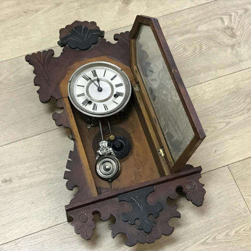 Antique Ansonia wall clock with beautifully decorated door