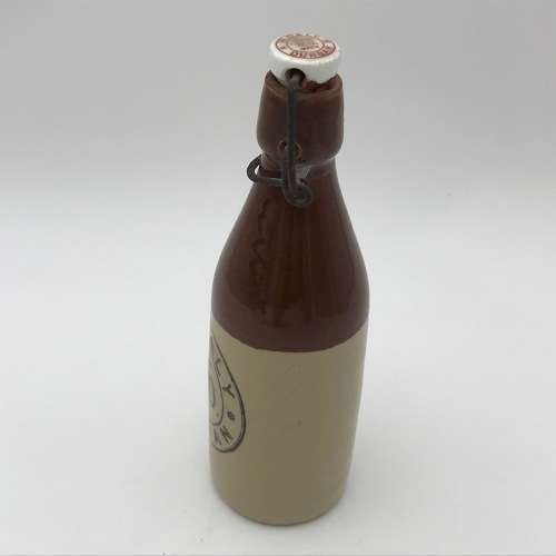 Antique W. Daly, Durban ceramic ginger beer bottle with lid