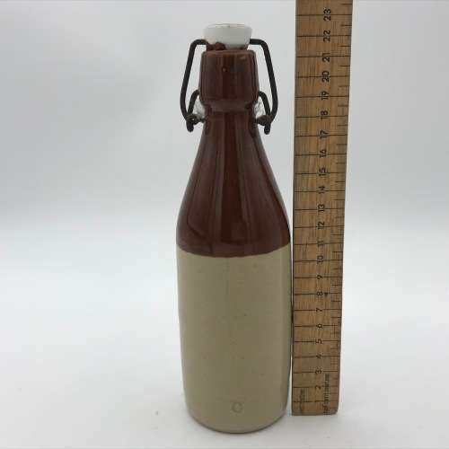 Antique W. Daly, Durban ceramic ginger beer bottle with lid