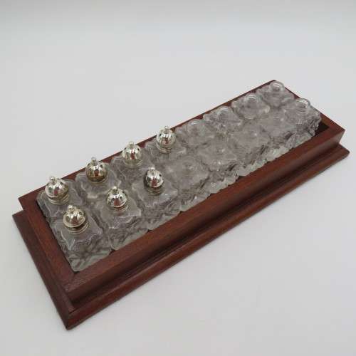 Wooden tray with 16 small salt and pepper shakers - 9 is missing lids