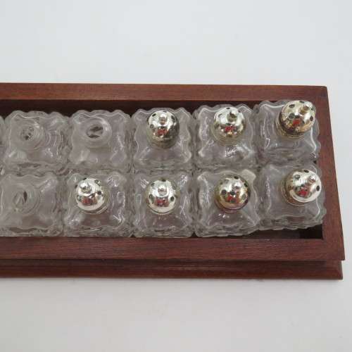 Wooden tray with 16 small salt and pepper shakers - 9 is missing lids