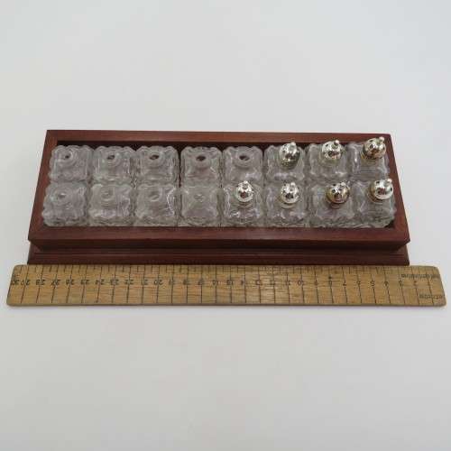 Wooden tray with 16 small salt and pepper shakers - 9 is missing lids