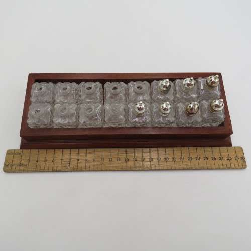 Wooden tray with 16 small salt and pepper shakers - 9 is missing lids
