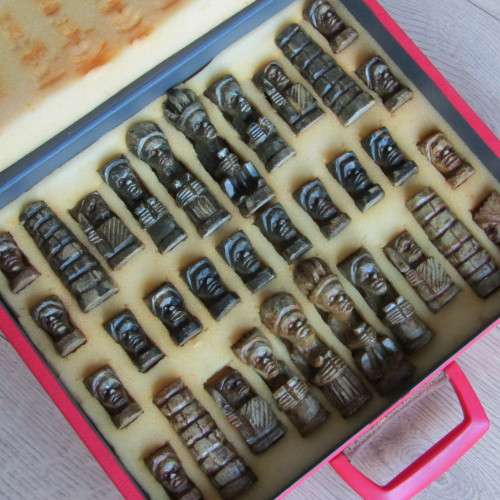 African soap stone carved chess set in suit case