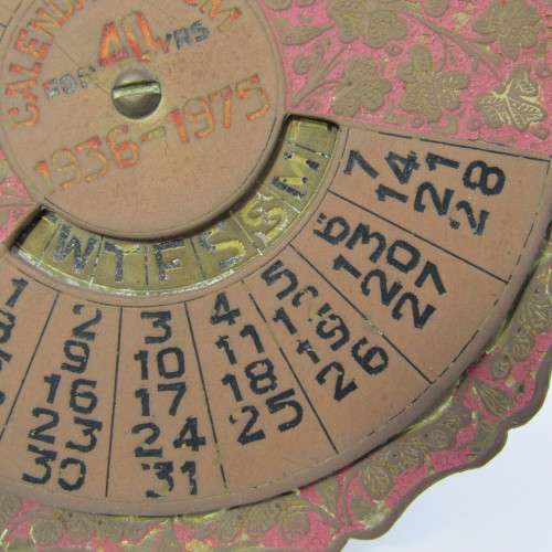 Vintage 1936-1975 brass 40 year calendar