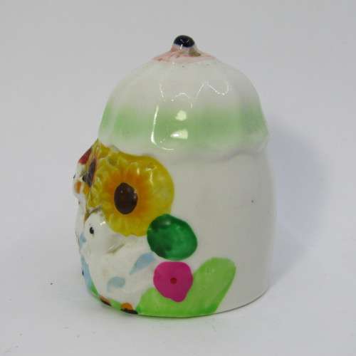 Pair of porcelain salt and pepper shakers with ducks and flowers