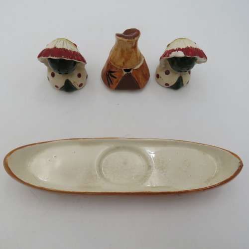 Vintage chiefs salt and pepper shakers on boat stand with mustard pot