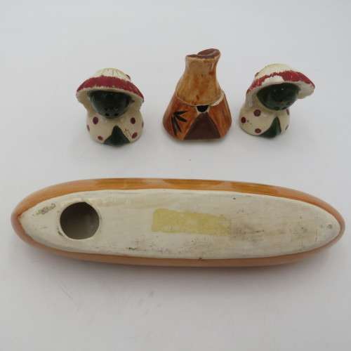 Vintage chiefs salt and pepper shakers on boat stand with mustard pot