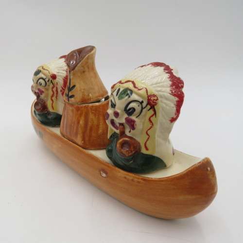 Vintage chiefs salt and pepper shakers on boat stand with mustard pot