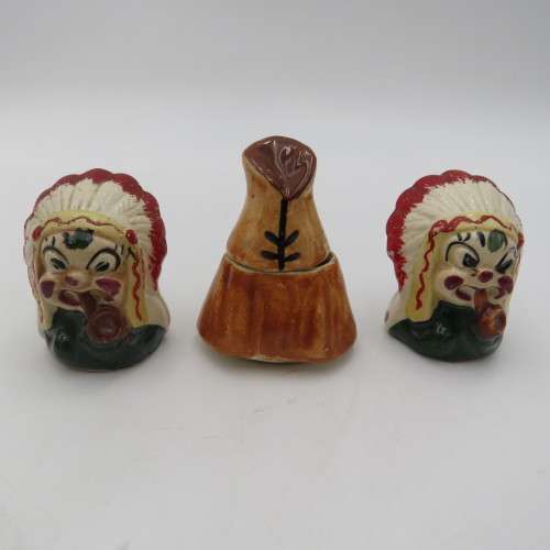 Vintage chiefs salt and pepper shakers on boat stand with mustard pot