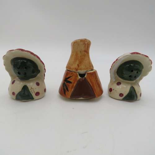 Vintage chiefs salt and pepper shakers on boat stand with mustard pot
