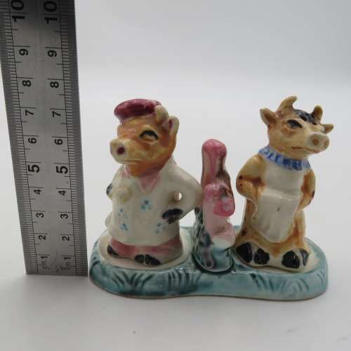 Vintage porcelain cow sale and pepper shakers on stand