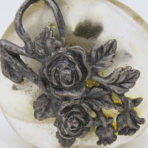 Vintage perfume bottle with silver-plated roses design