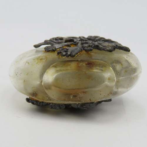 Vintage perfume bottle with silver-plated roses design