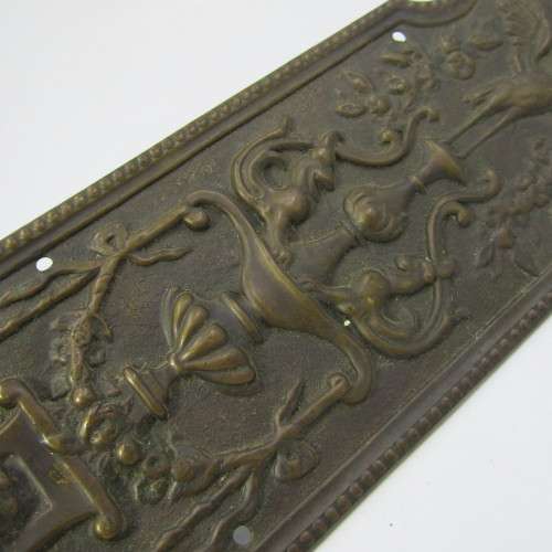 Vintage brass Stork and Baby themed door decor piece