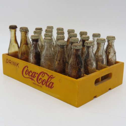 Vintage miniature Coca-Cola bottles in yellow tray - Two Coke bottles missing and was replaced