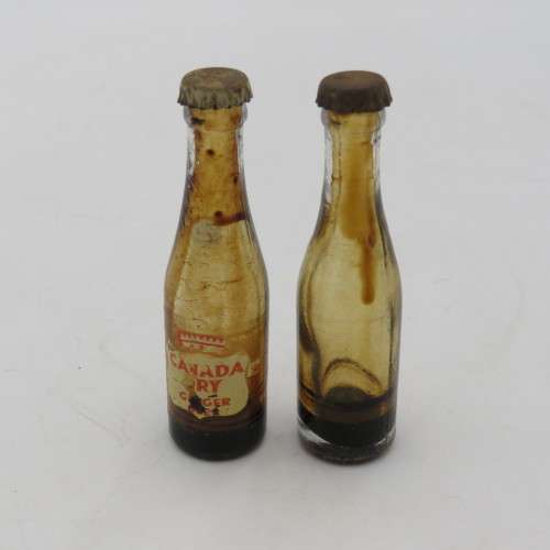 Vintage miniature Coca-Cola bottles in yellow tray - Two Coke bottles missing and was replaced