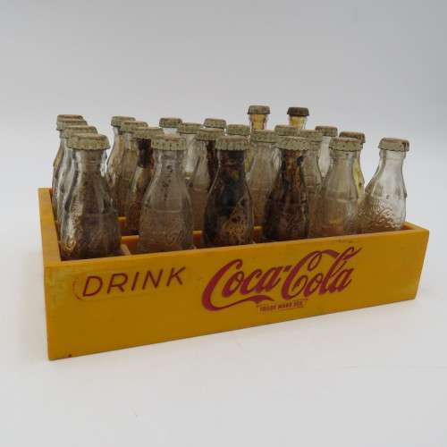Vintage miniature Coca-Cola bottles in yellow tray - Two Coke bottles missing and was replaced