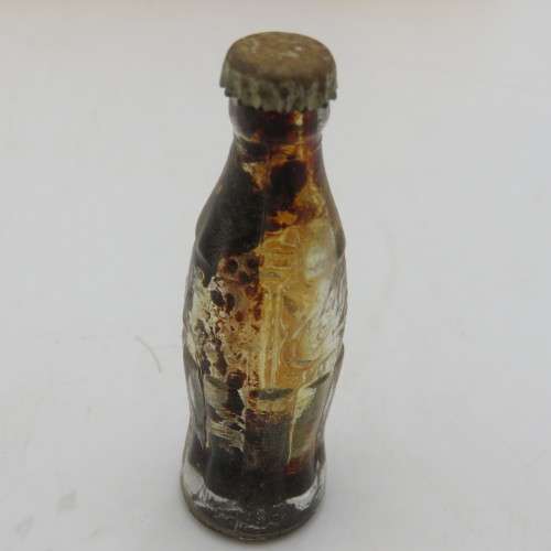 Vintage miniature Coca-Cola bottles in yellow tray - Two Coke bottles missing and was replaced
