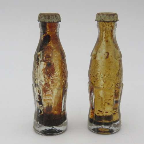 Vintage miniature Coca-Cola bottles in yellow tray - Two Coke bottles missing and was replaced