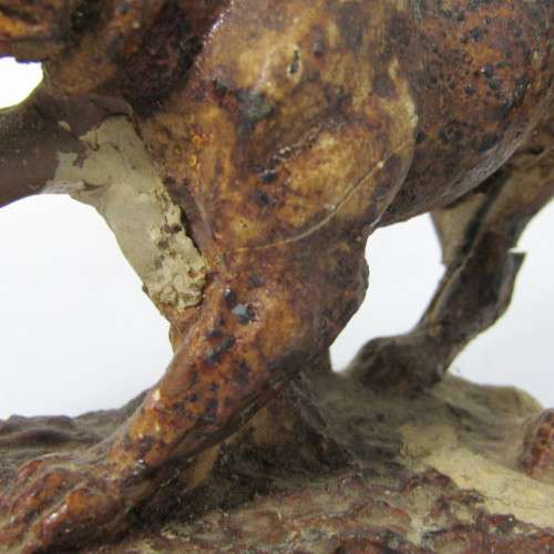 Vintage resin figurine of boy being bitten by bulldog - repaired