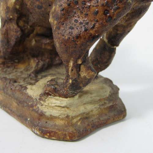 Vintage resin figurine of boy being bitten by bulldog - repaired