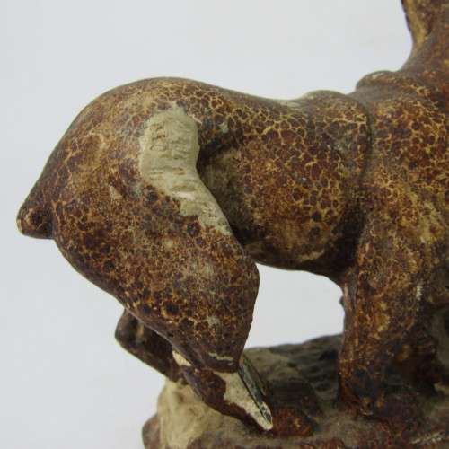 Vintage resin figurine of boy being bitten by bulldog - repaired