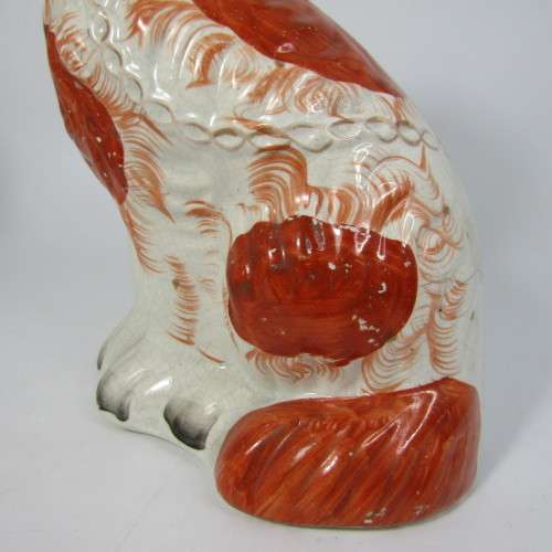 Pair of Staffordshire Spaniels porcelain figurines - some damage