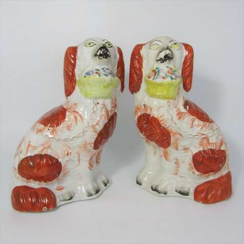 Pair of Staffordshire Spaniels porcelain figurines - some damage