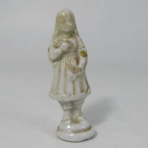 Pair of antique porcelain figurines from coffee tins