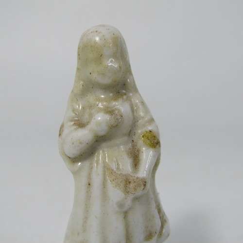 Pair of antique porcelain figurines from coffee tins
