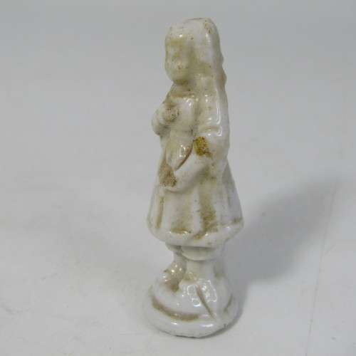 Pair of antique porcelain figurines from coffee tins