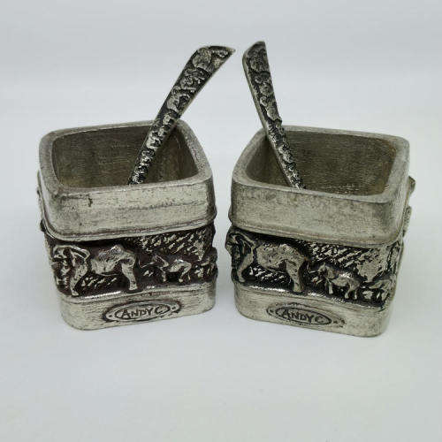 Pair of Andy C salt holders with spoons