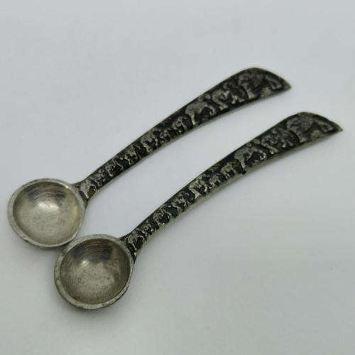 Pair of Andy C salt holders with spoons