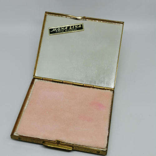 Mona Lisa powder box with hundreds of stars on lid - mirror inside